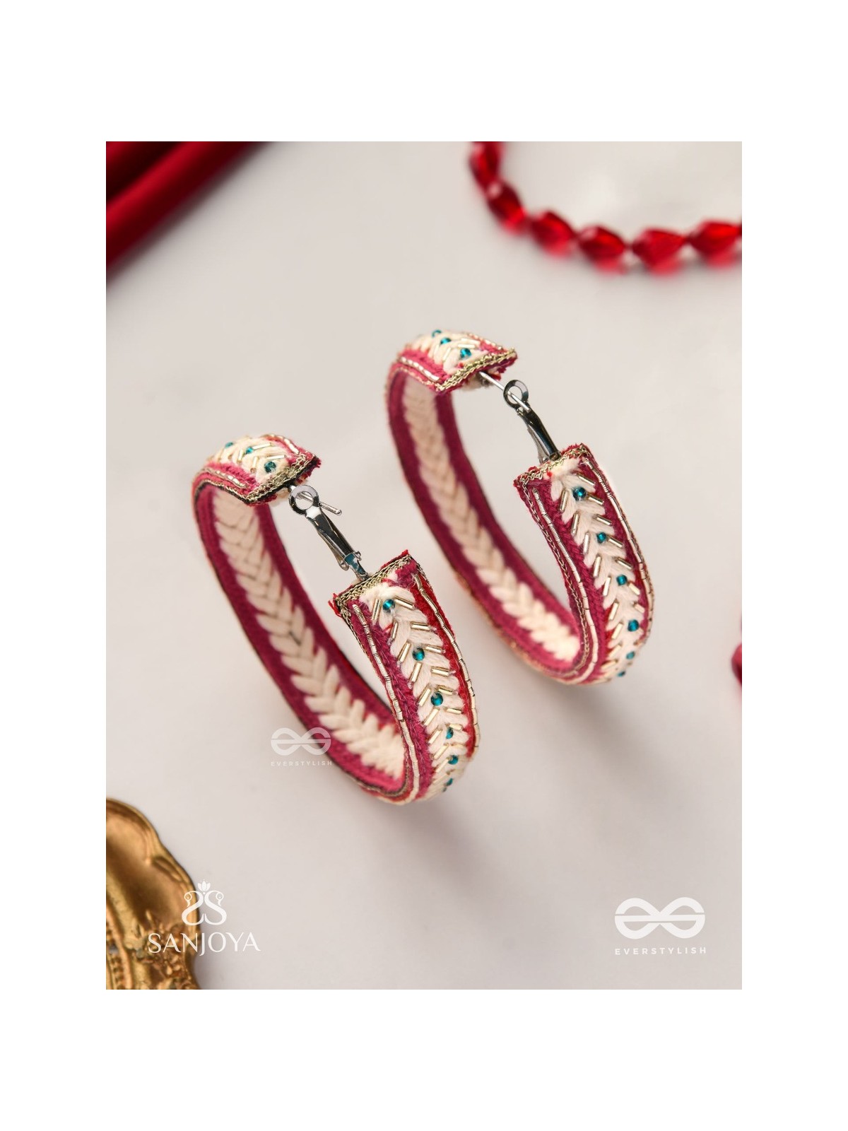 Vasantiruchi- Spring Charm- Embroidered earrings with red and white threads, decorated with beads and gold accents