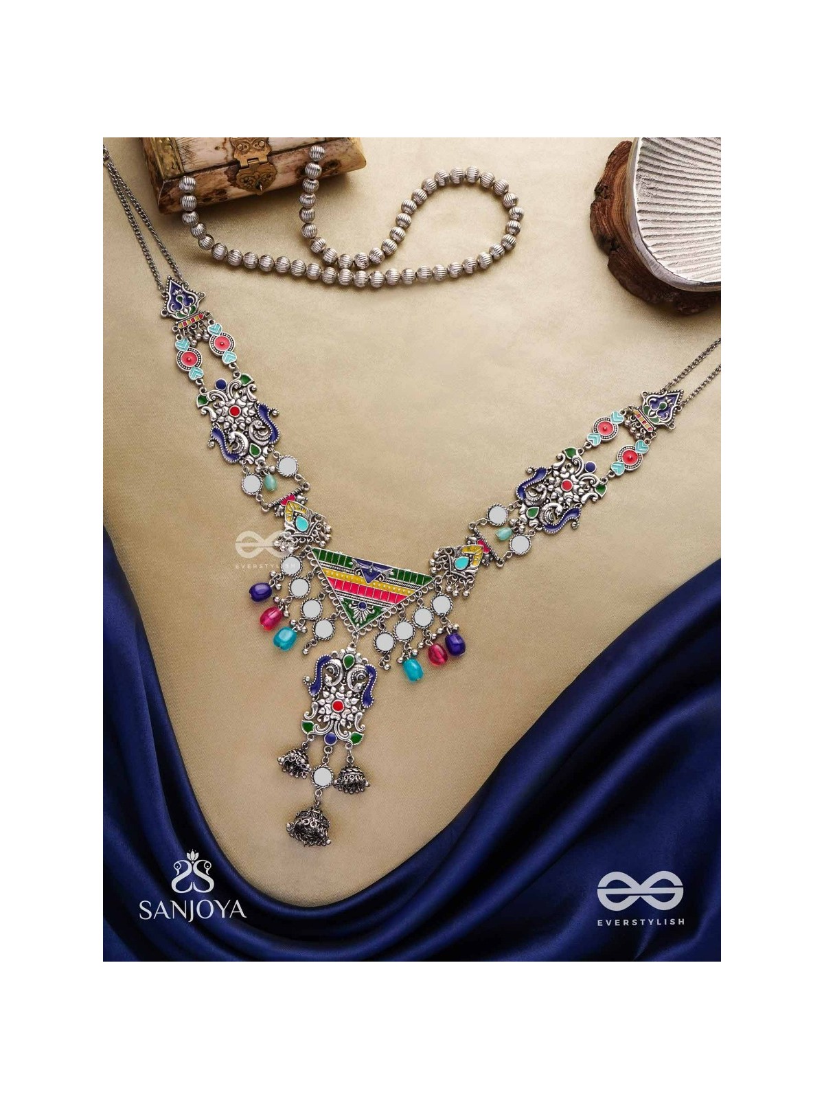 Prema raga- Love colour- Enamelled oxidized neckpiece embellished with beads, mirror and dangling jhumka.