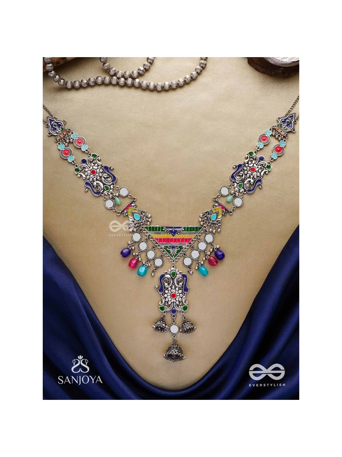 Prema raga- Love colour- Enamelled oxidized neckpiece embellished with beads, mirror and dangling jhumka.