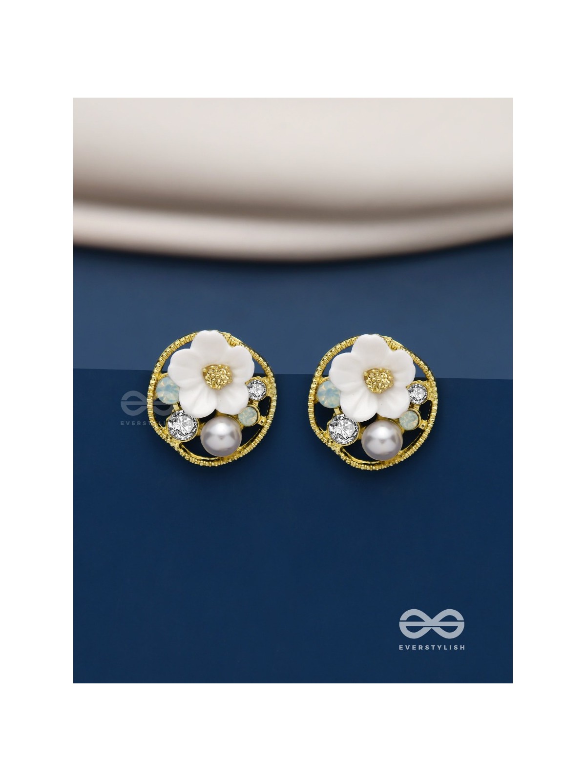 Divine temptation- white floral studs encircled with golden mesh 