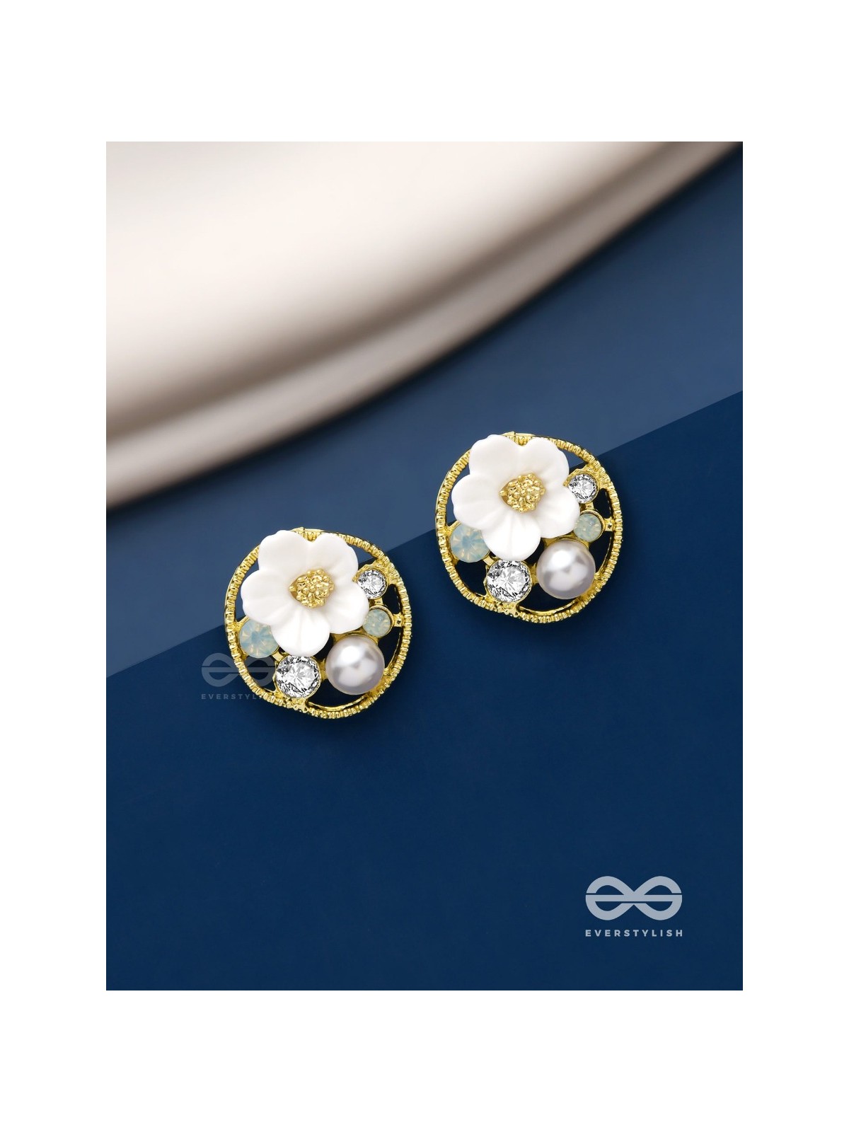 Divine temptation- white floral studs encircled with golden mesh 