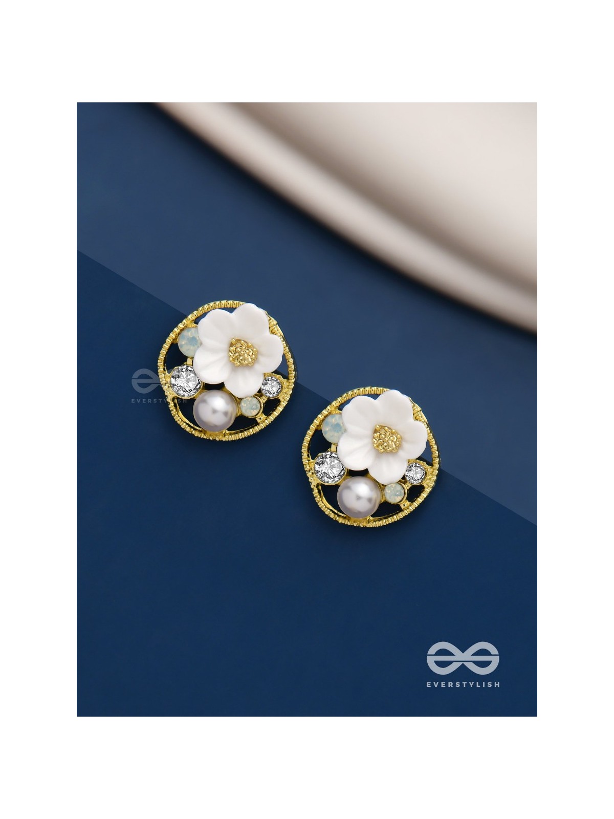 Divine temptation- white floral studs encircled with golden mesh 