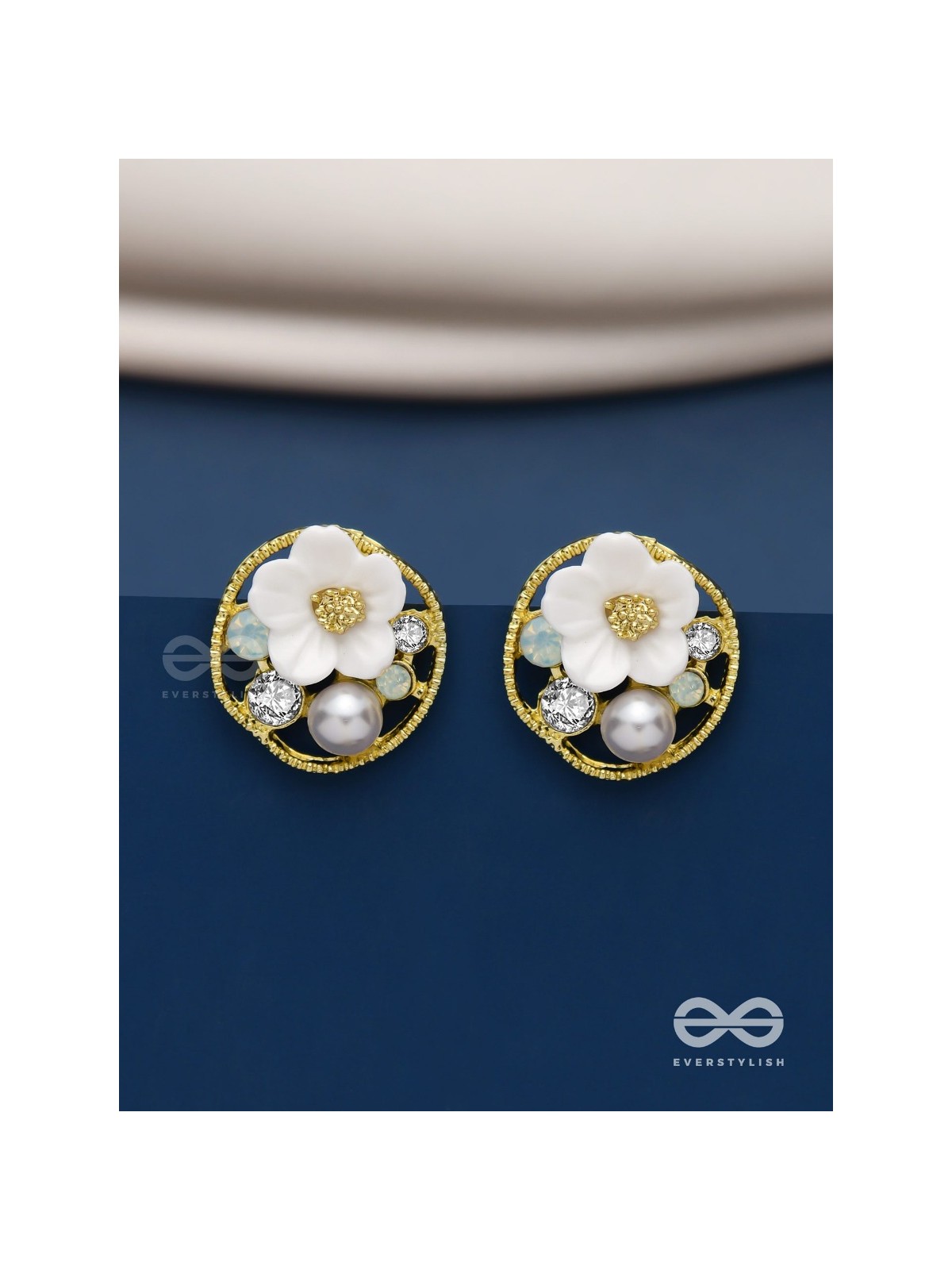 Divine temptation- white floral studs encircled with golden mesh 