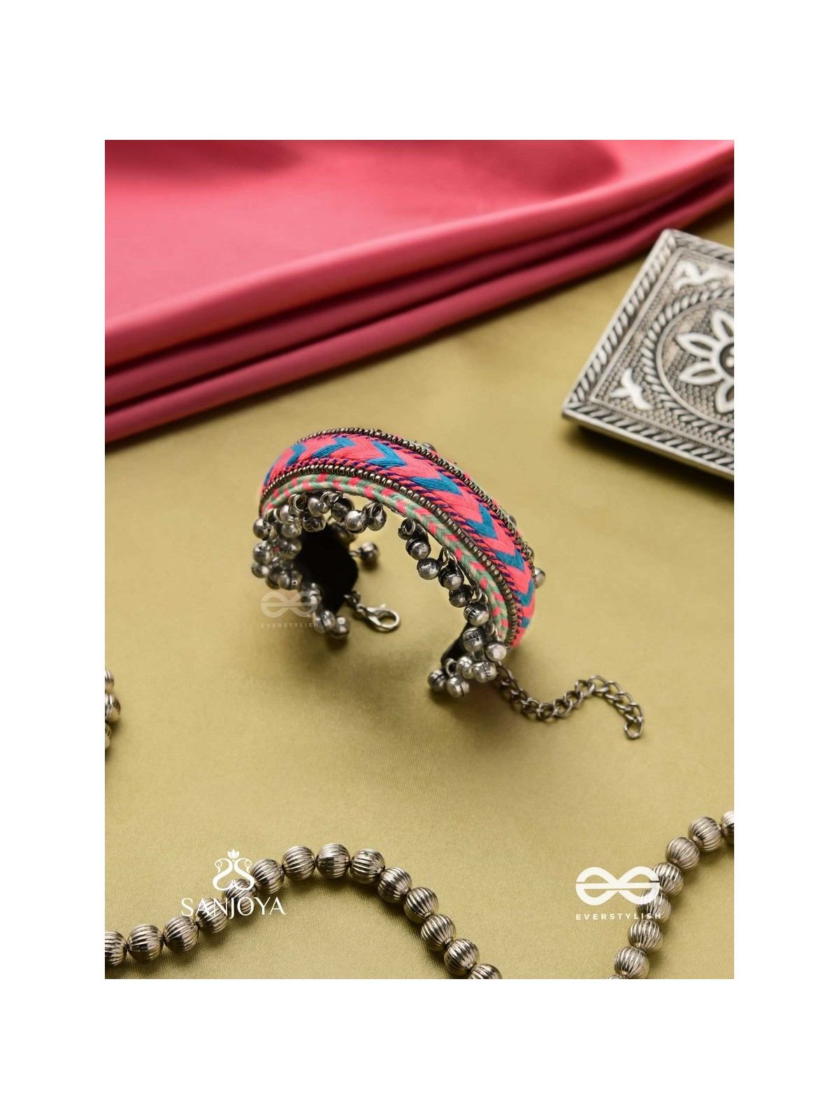 CHITRA DHARA – FLOW OF COLORS   EMBROIDERED BRACELET WITH A MIX OF COLORS AND INTRICATE THREAD WORK, ADORNED WITH GHUNGROO'S