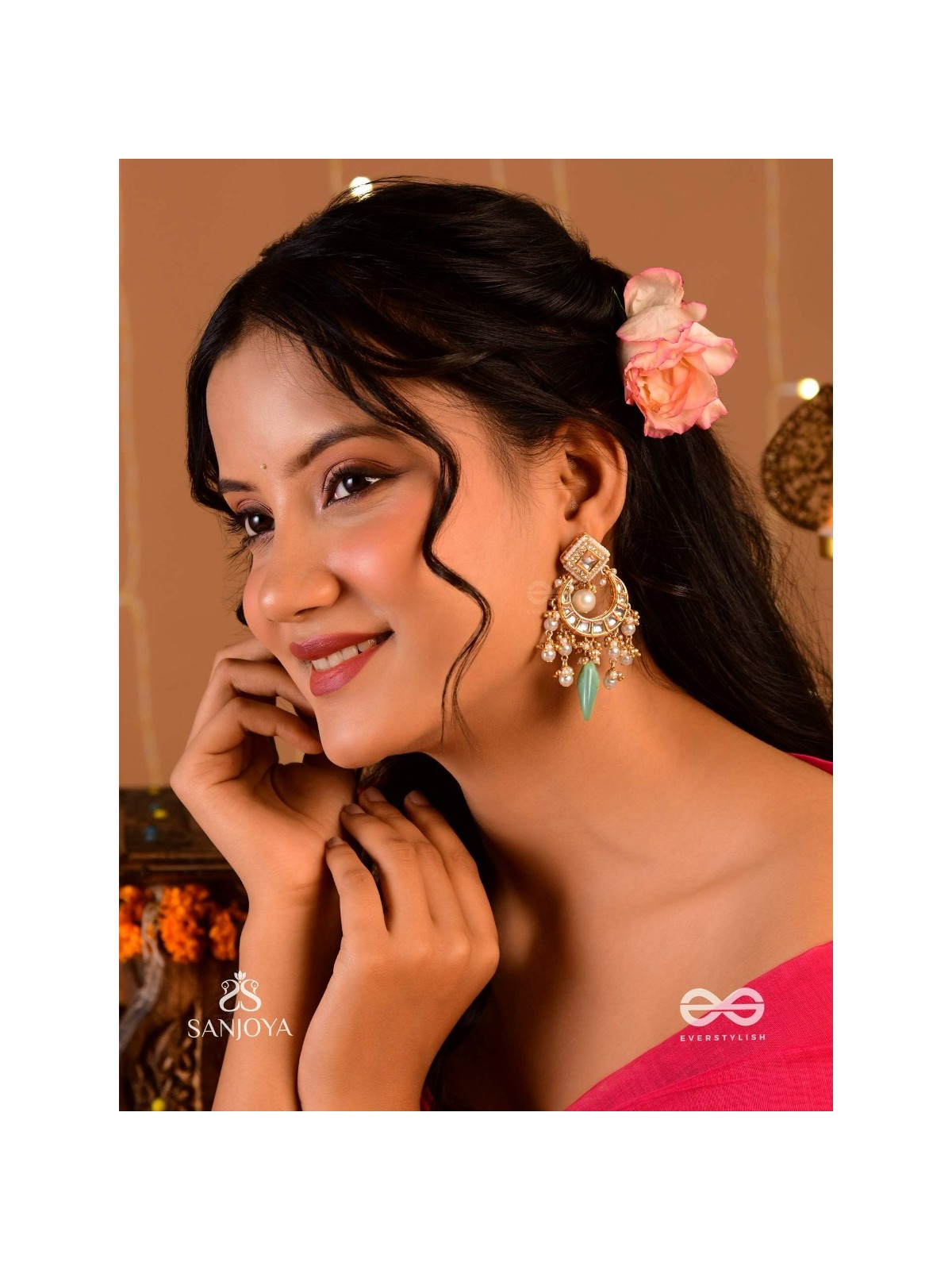 PURNIMA PHOOL – FULL MOON FLOWER AN EXQUISITE KUNDAN EARRING FEATURING GOLDEN DESIGNS, PEARL CLUSTERS, AND A GREEN GEMSTONE DROP, SYMBOLIZING ELEGANCE