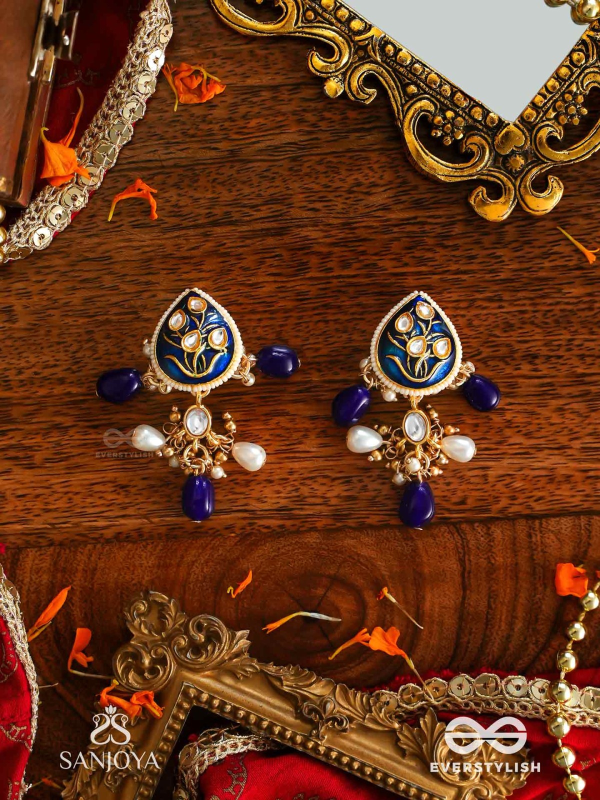 NILACHANDRIKA- MOONLIGHT OF THE BLUE SKY- KUNDAN EARRINGS WITH DEEP BLUE ENAMEL WORK WITH GOLDEN DETAILS, PEARLS, AND DAZZLING GEMS