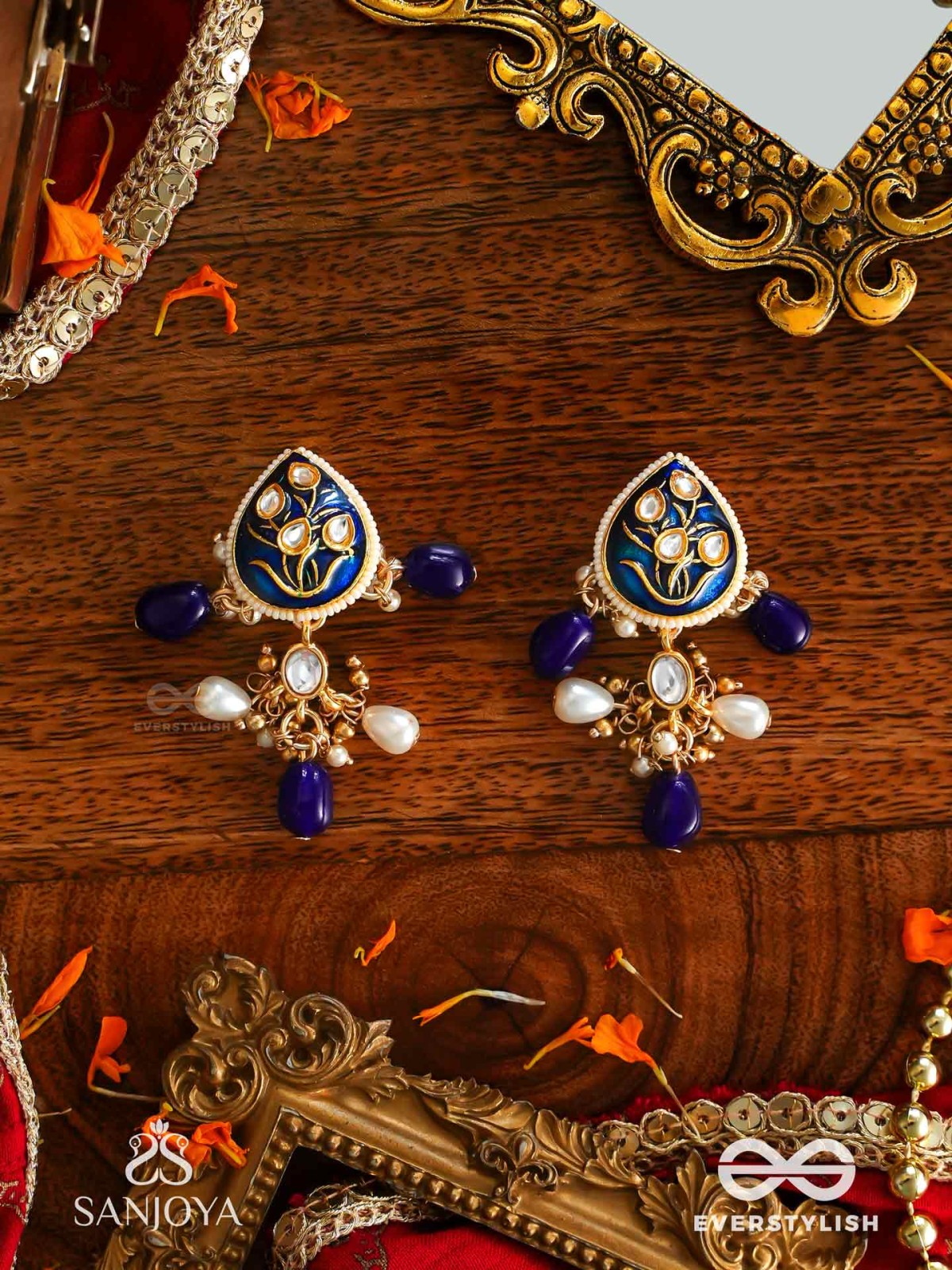 NILACHANDRIKA- MOONLIGHT OF THE BLUE SKY- KUNDAN EARRINGS WITH DEEP BLUE ENAMEL WORK WITH GOLDEN DETAILS, PEARLS, AND DAZZLING GEMS