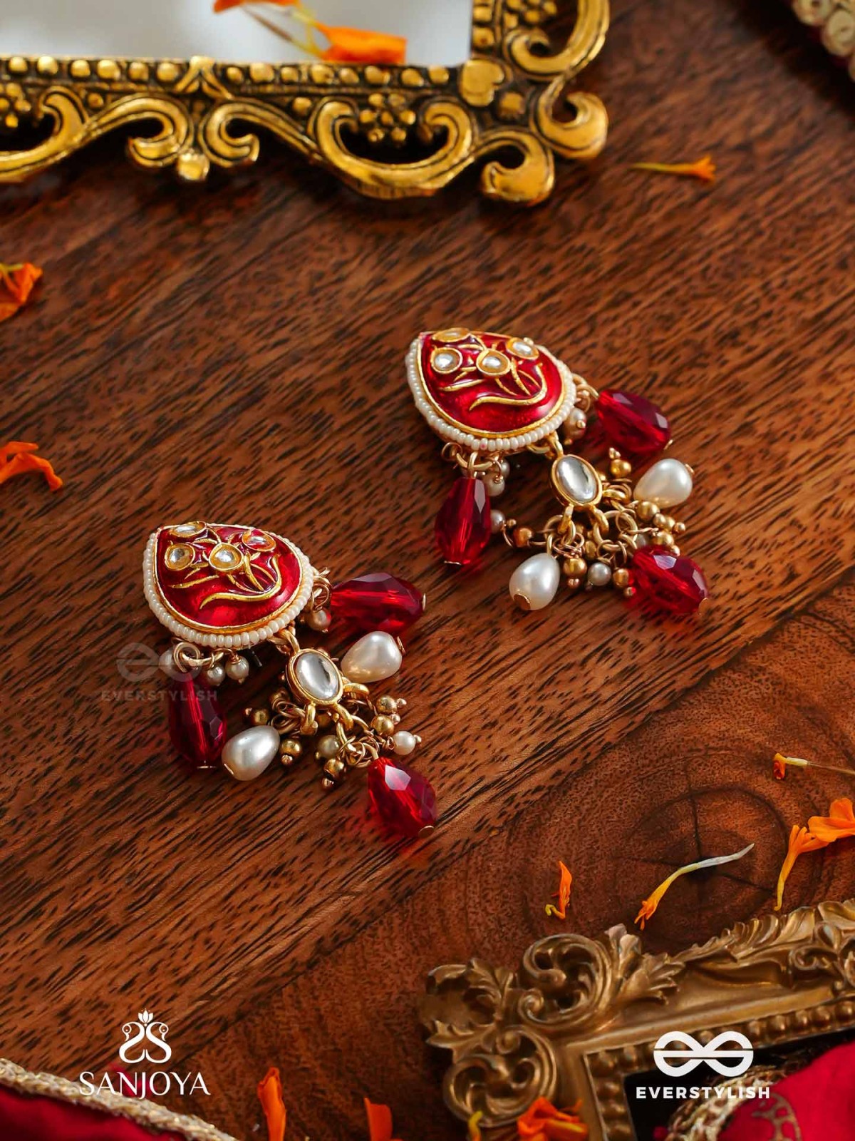 ARUNAMUKHI- FACE OF THE RED SUN- GLORIOUS KUNDAN EARRINGS WITH RED ENAMEL DETAILS AND PEARL EMBELLISHMENTS 