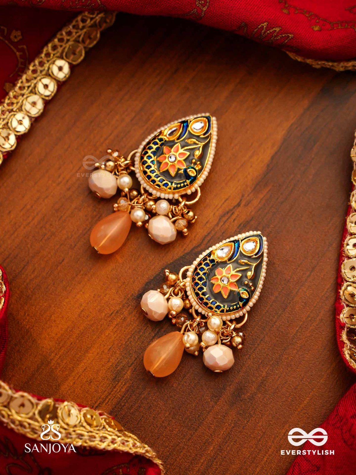 SANDHYAPRIYA - LOVER OF DUSK - EXQUISITE GOLDEN ENAMELLED KUNDAN EARRINGS WITH LUSTROUS ORANGE GEM DROPS