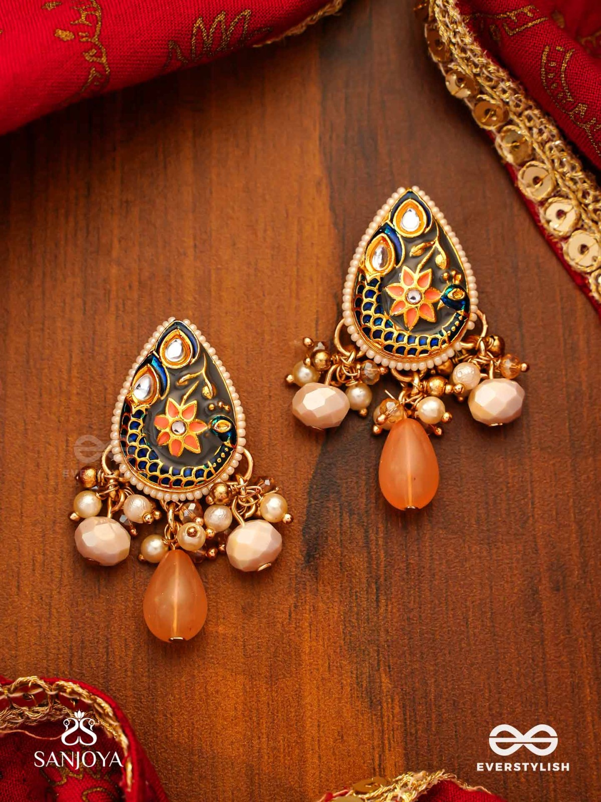 SANDHYAPRIYA - LOVER OF DUSK - EXQUISITE GOLDEN ENAMELLED KUNDAN EARRINGS WITH LUSTROUS ORANGE GEM DROPS