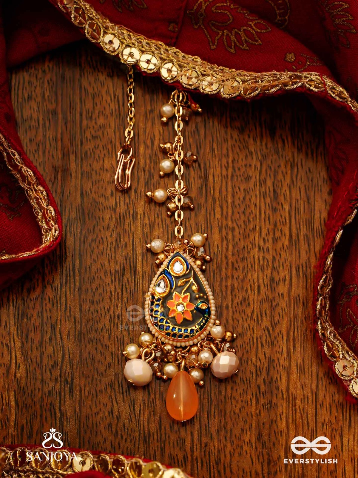 SANDHYAPRIYA - LOVER OF DUSK - EXQUISITE GOLDEN ENAMELLED KUNDAN MAANGTIKA WITH LUSTROUS ORANGE GEM DROPS