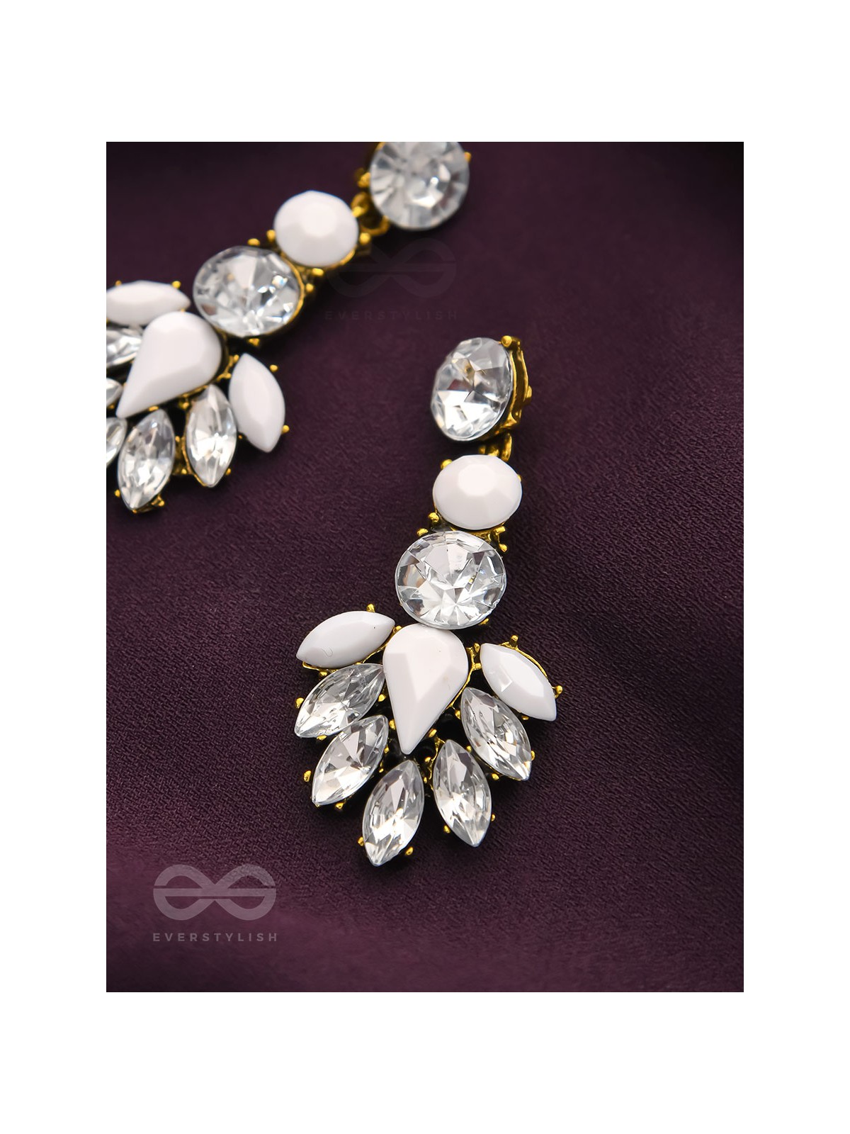 The pious touch white enigmatic stones studded earrings 