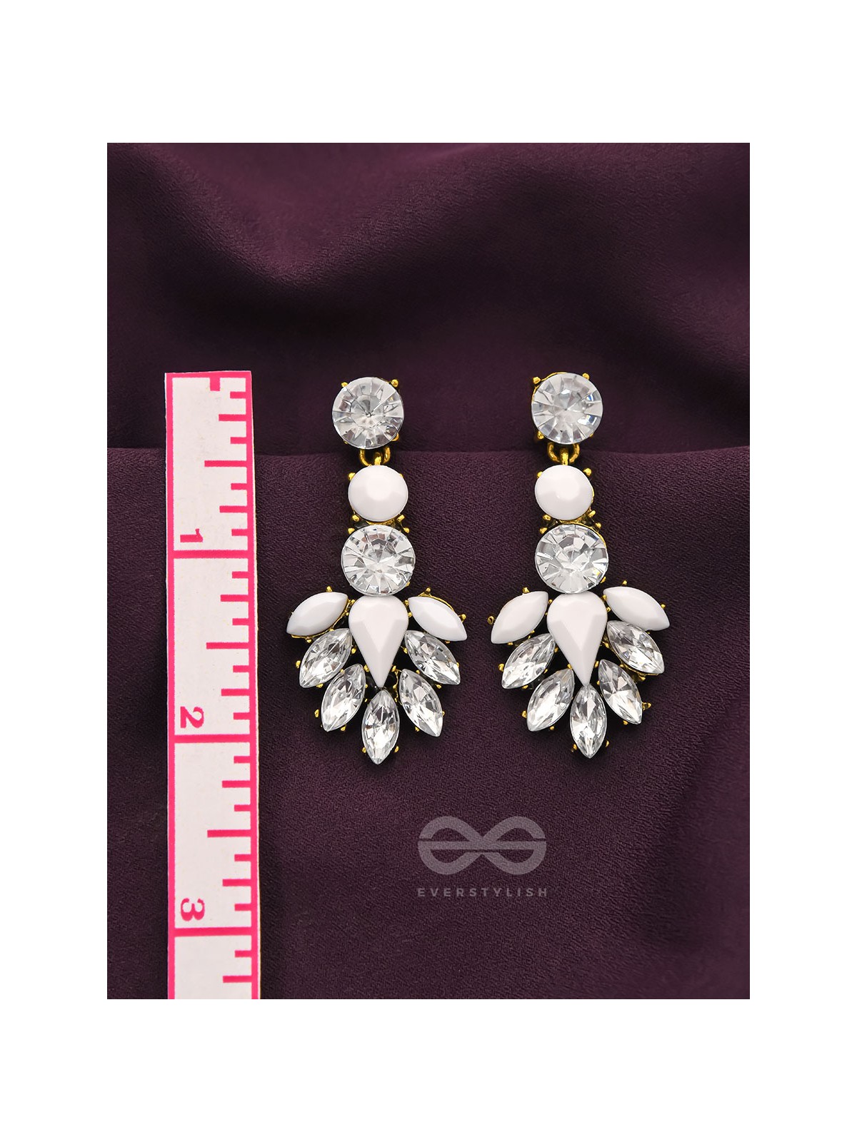 The pious touch white enigmatic stones studded earrings 