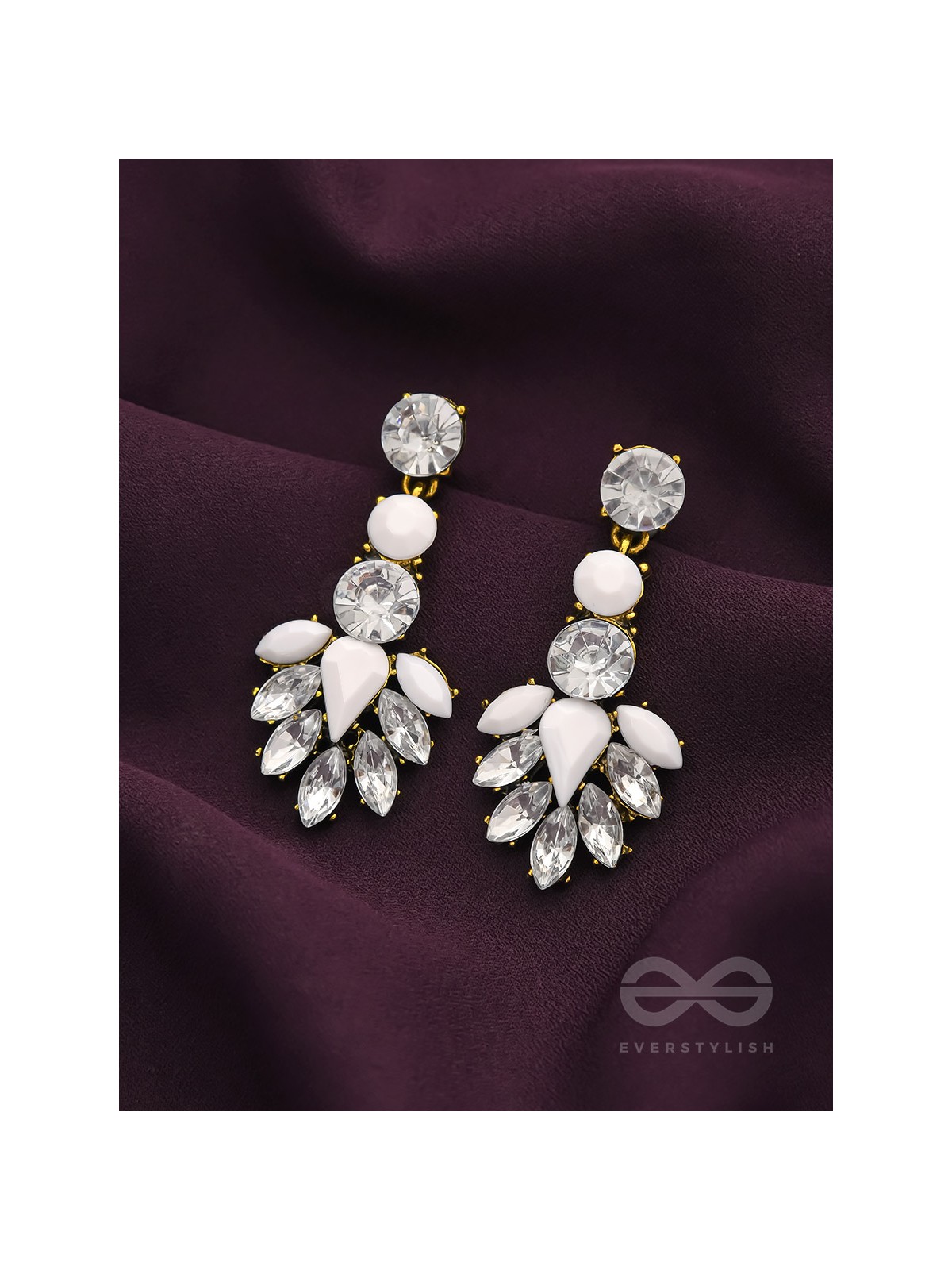 The pious touch white enigmatic stones studded earrings 