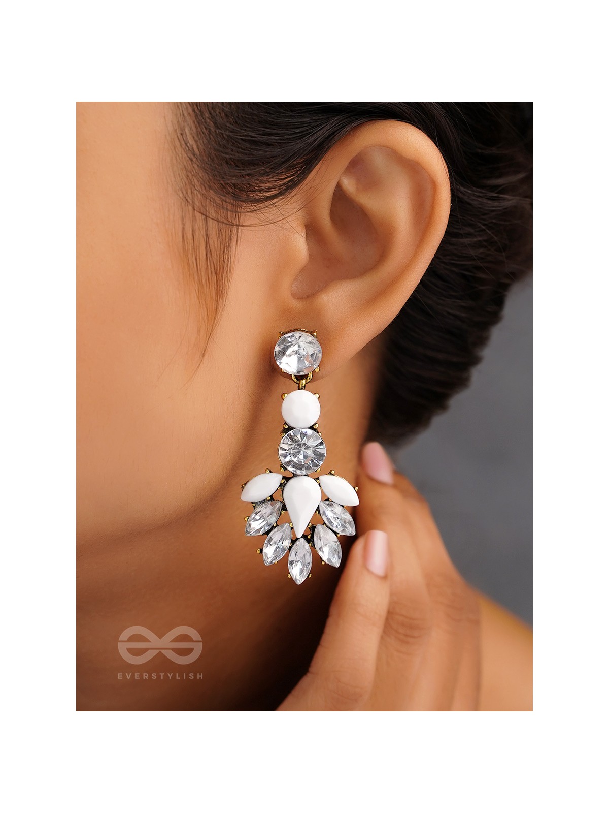The pious touch white enigmatic stones studded earrings 