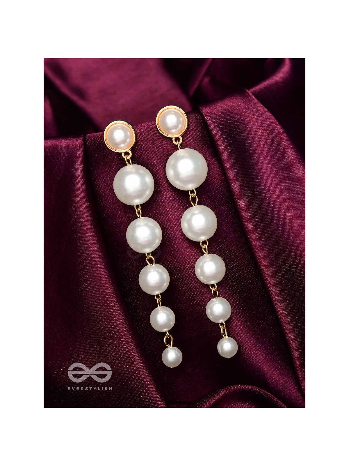 Elegance is a deadly weapon- white pearls statement earrings