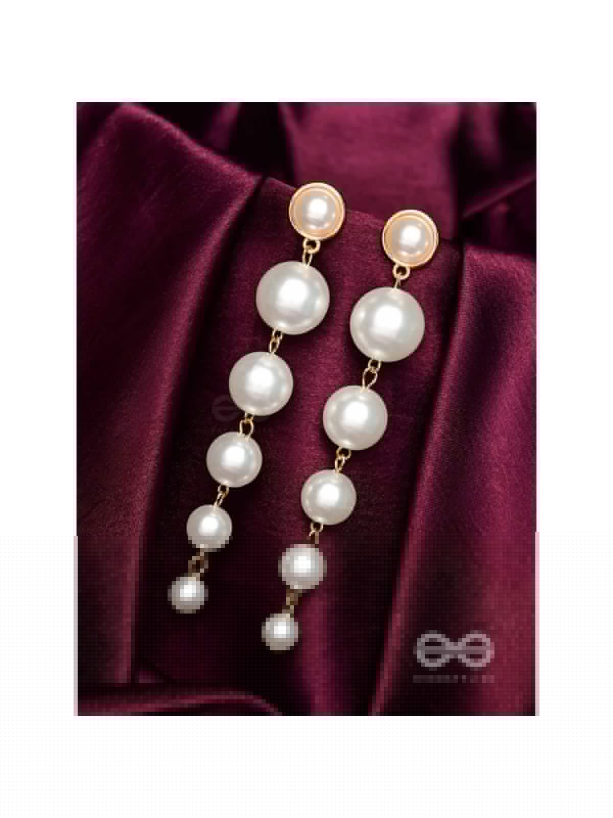 Elegance is a deadly weapon- white pearls statement earrings