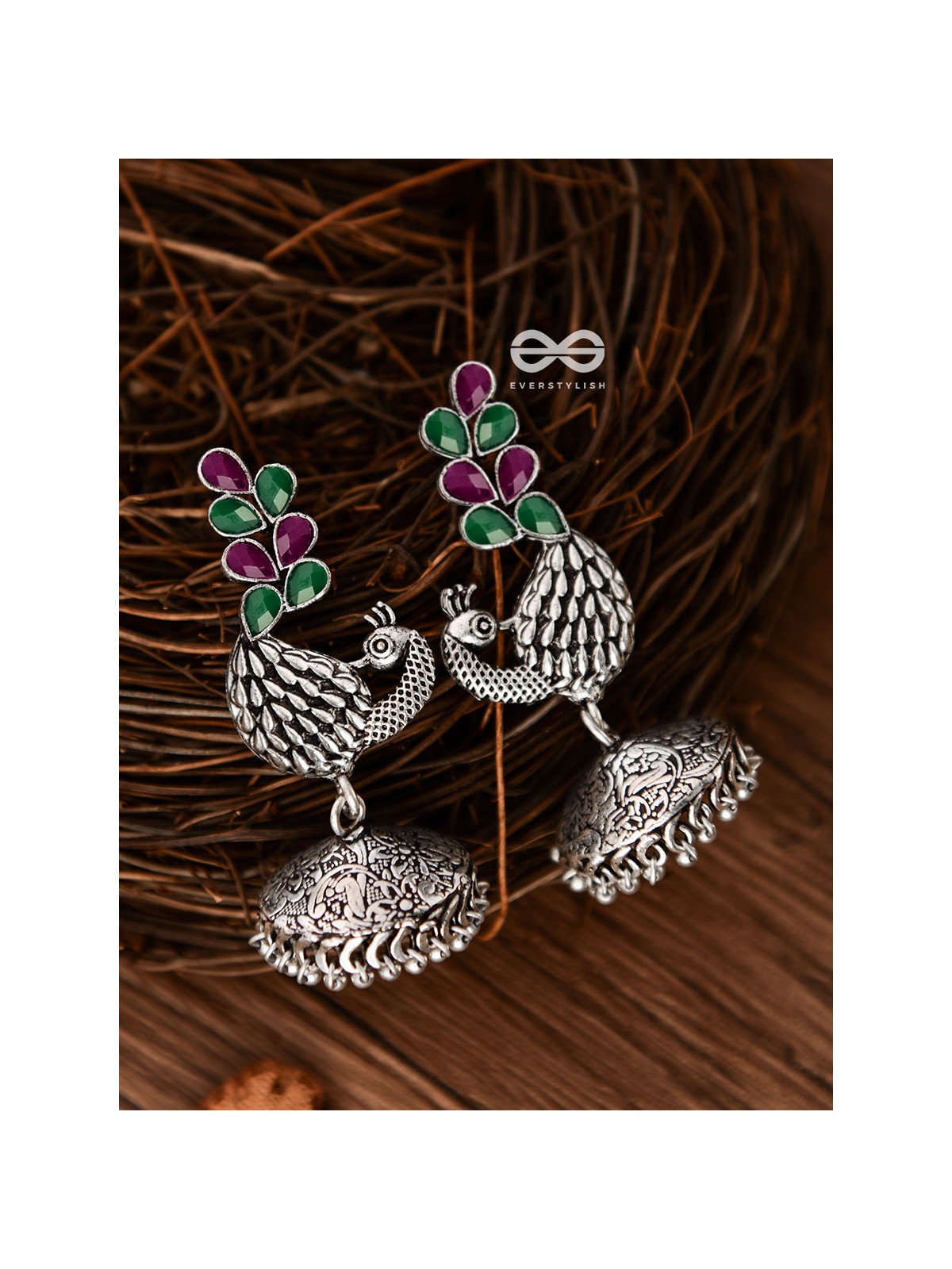 The Dancing Peacocks Engraved Jhumkis (Ruby Emerald) - Embellished Oxidised Collection