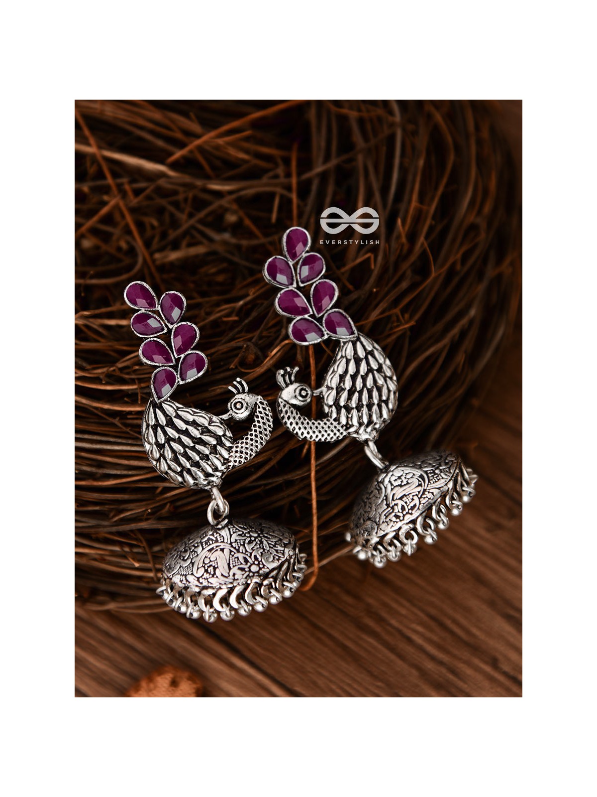 The Dancing Peacocks Engraved Jhumkis (Ruby Red) - Embellished Oxidised Collection