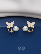 A WINGED WONDER - GOLDEN AND WHITE EAR JACKETS