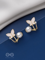 A WINGED WONDER - GOLDEN AND WHITE EAR JACKETS