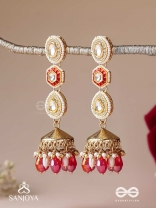 Suvarnmani - The Golden Gem –Golden enamel earrings adorned with gemstones and dangling beads