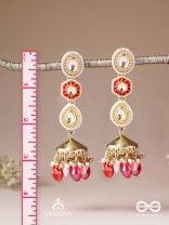 Suvarnmani - The Golden Gem –Golden enamel earrings adorned with gemstones and dangling beads