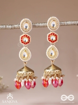 Suvarnmani - The Golden Gem –Golden enamel earrings adorned with gemstones and dangling beads