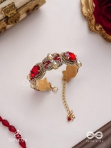 Sundarasūra- Beautiful Wine- Bracelet with rich hue of the red stones and twisted thread work.