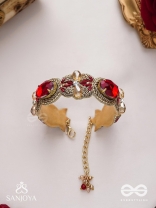 Sundarasūra- Beautiful Wine- Bracelet with rich hue of the red stones and twisted thread work.