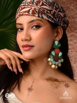 Vikṛtiśīla- Elegant Form-Chunky blue, green, and rust-colored stones with a distinctive golden-silver leaflet design