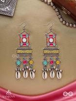 SINGHASANAMUKTA- THRONE GEM- OXIDIZED ENAMELLED EARRINGS IN MULTICOLOUR MOTIFS WITH GHUNGHROO'S AND COWRIE SHELLS