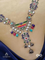 Prema raga- Love colour- Enamelled oxidized neckpiece embellished with beads, mirror and dangling jhumka.
