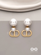 Starlit orb- dangling pearl earrings with golden spheres 