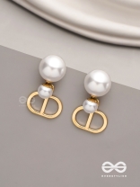 Starlit orb- dangling pearl earrings with golden spheres 