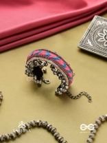 CHITRA DHARA – FLOW OF COLORS   EMBROIDERED BRACELET WITH A MIX OF COLORS AND INTRICATE THREAD WORK, ADORNED WITH GHUNGROO'S