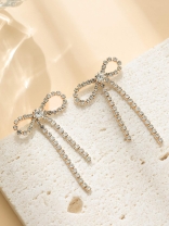 GOLDEN GLIMMER BOW -  GRACEFUL AND SPARKLING BOW EARRINGS