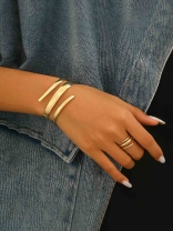 AURIC SWIRL - CONTEMPORARY GOLDEN TWIST RING+ TWISTED GLEAM- SLEEK AND POLISHED METALLIC CUFF BRACELET