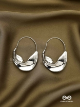 SILVER DRIFT- SCULPTED SILVER HOOPS WITH A FLUID