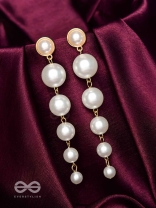 Elegance is a deadly weapon- white pearls statement earrings