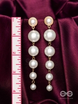Elegance is a deadly weapon- white pearls statement earrings